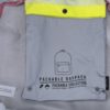 Žlto-sivý reflexný skladací batoh Herschel Packable 24,5 l