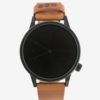 Čierne unisex hodinky s hnedým koženým remienkom Komono Winston Regal