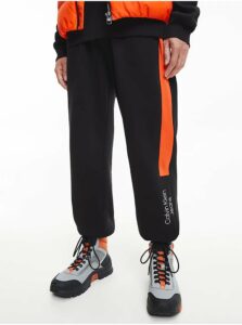 Tepláky pre mužov Calvin Klein Jeans - čierna, oranžová